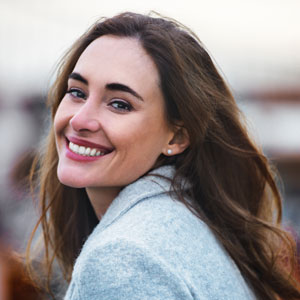 Woman looking over her shoulder smiling