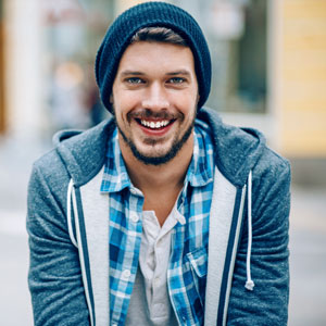 Young man in sweatshirt and beanie