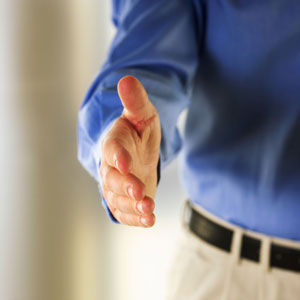 man extending hand for handshake